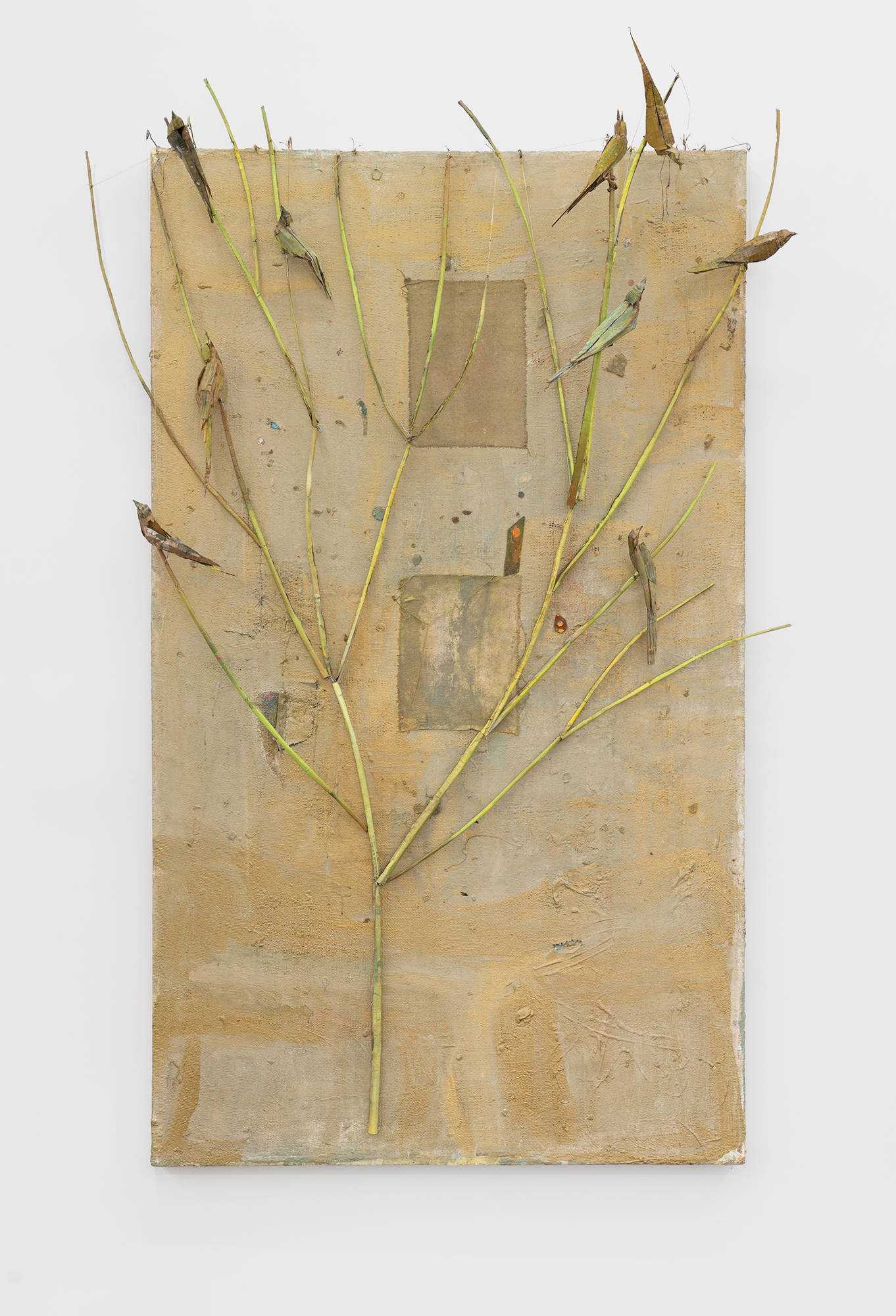 A large gold painting featuring a sculpture of a tree with birds by Tom Thayer.