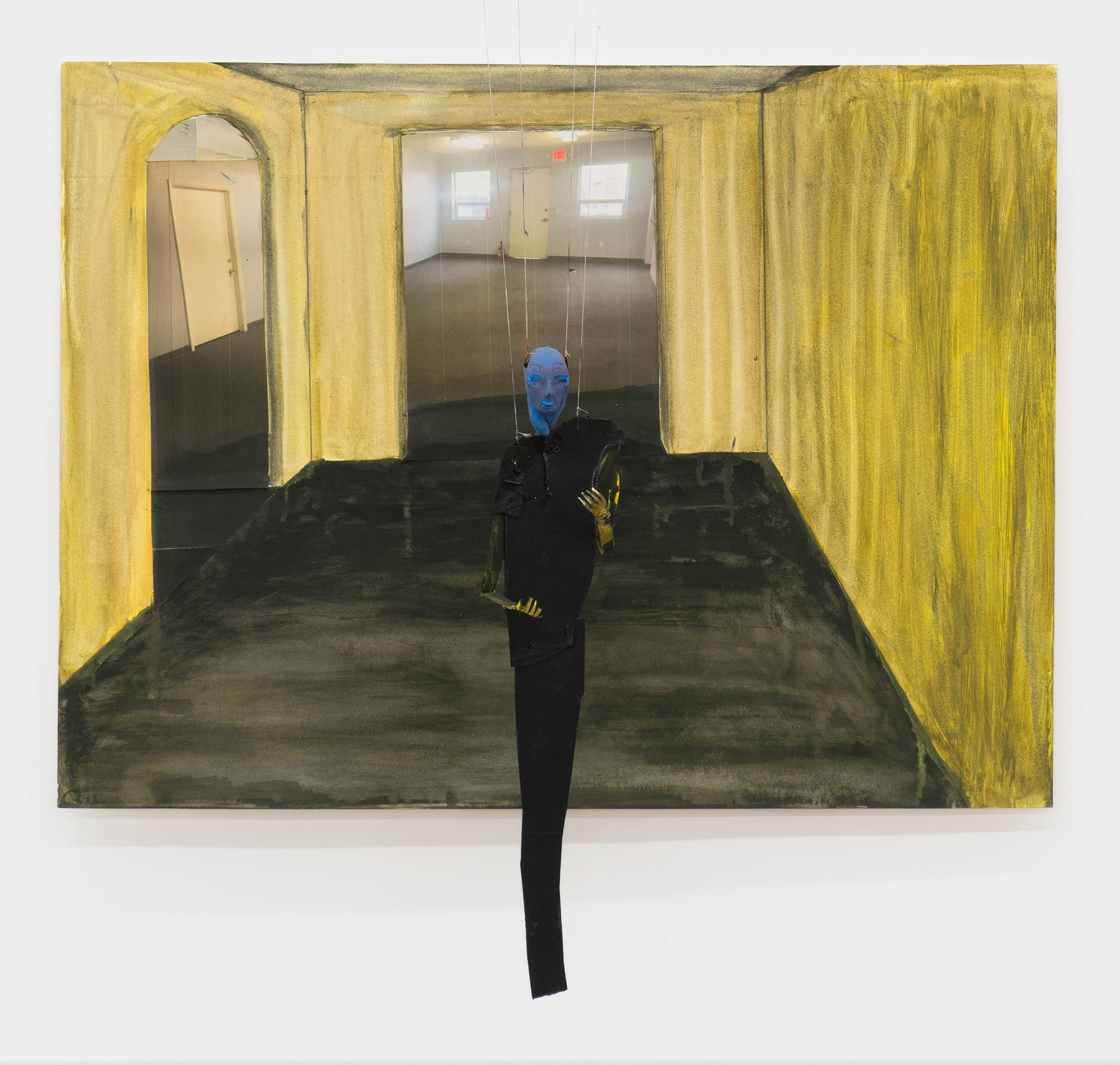 A puppet with blue head and black clothes dangles in front of a collage of a green room with two doorways; one arched, one square. through the doorways are pasted images of liminal spaces.