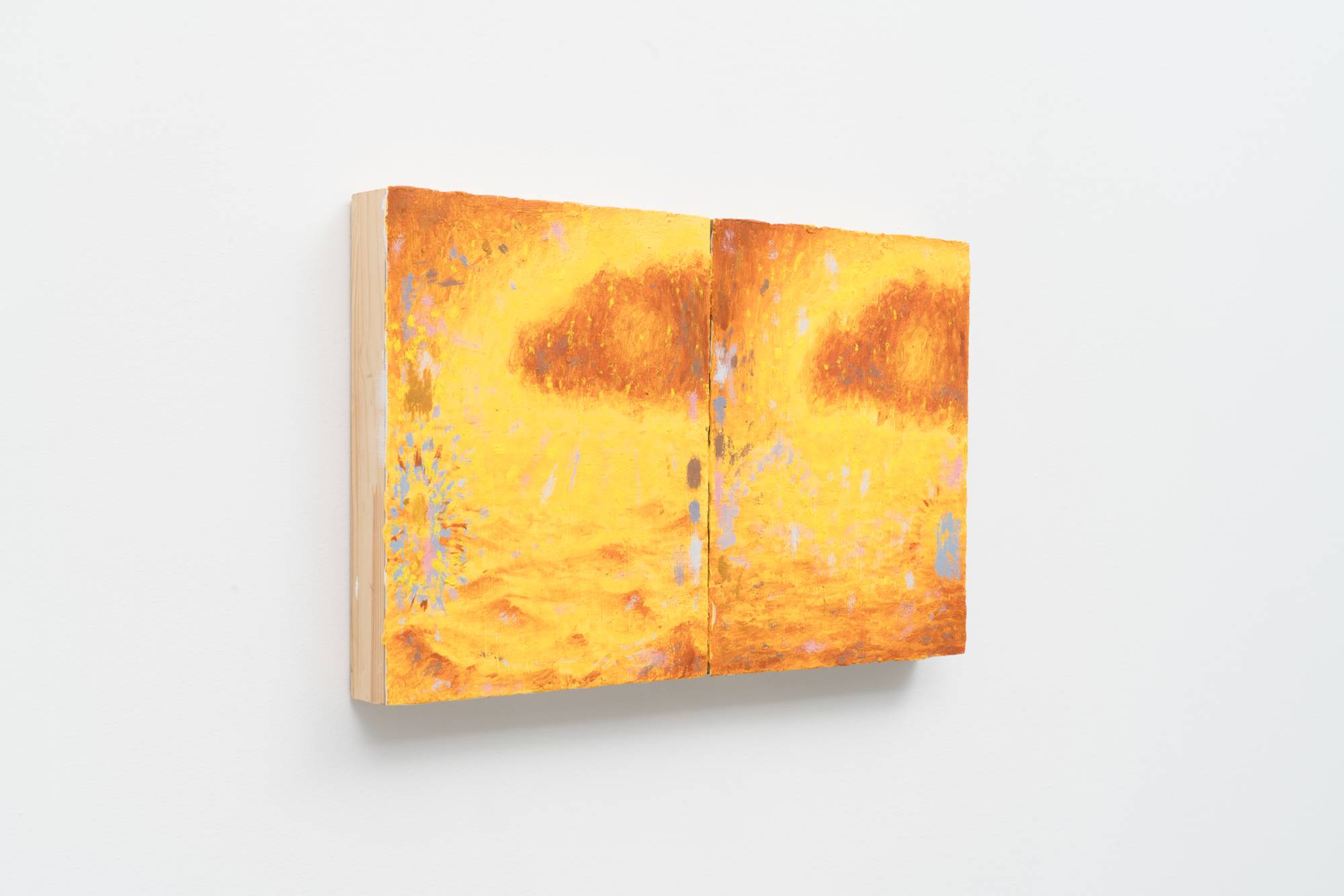 Side view of a small diptych of two nearly identical paintings of a monochromatic yellow ocean landscape with a dark cloud in the sky. In the left landscape, the waters are choppy. In the right, they are calm. There are small graphic details around the border of the paintings in hues of grey, brown, and pink.