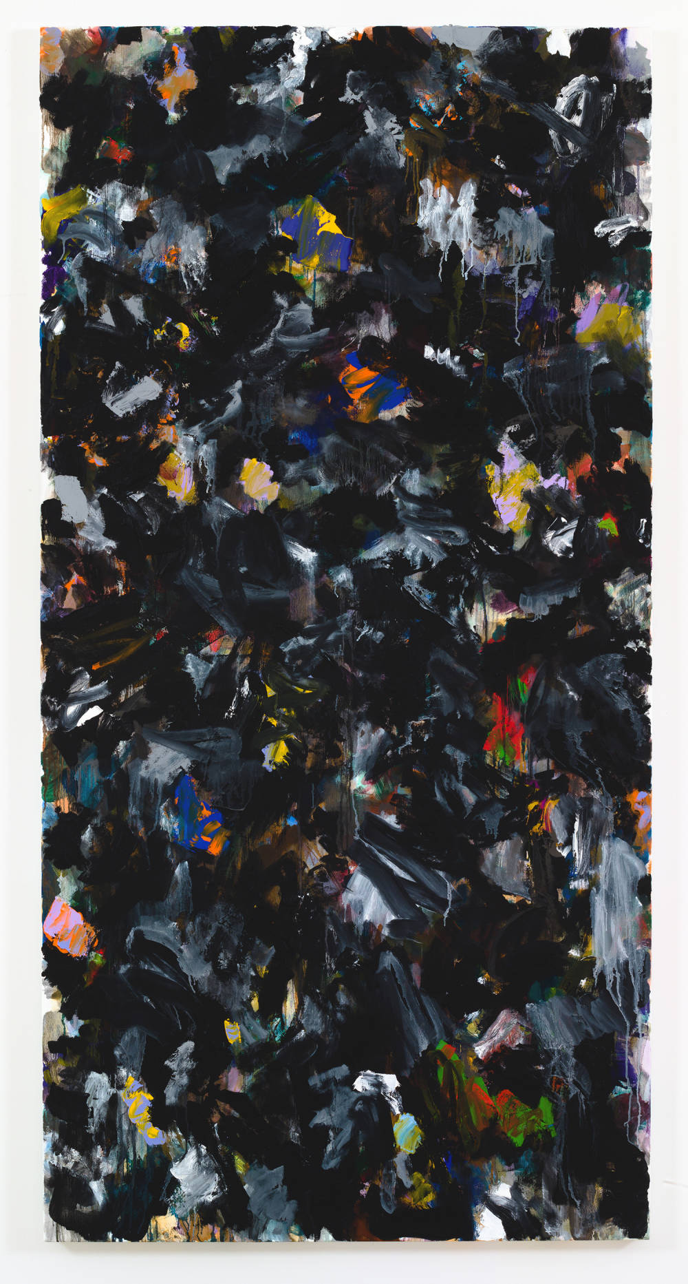 A large abstract painting with numerous swatches of color on top of one another. The dominant color is black. The paint is applied in thin layers and in some areas is dripping.