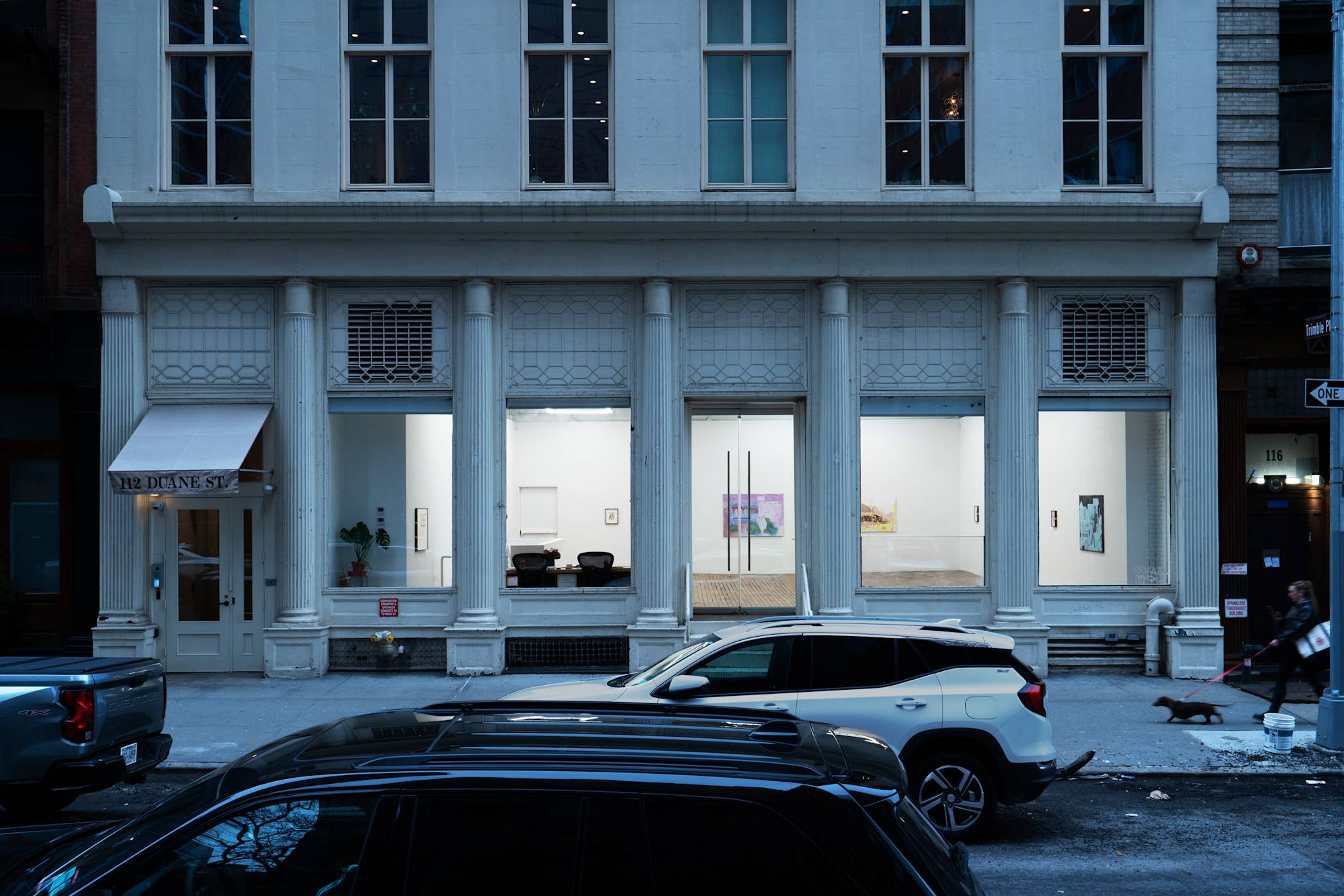 Exterior view of art gallery at dusk.