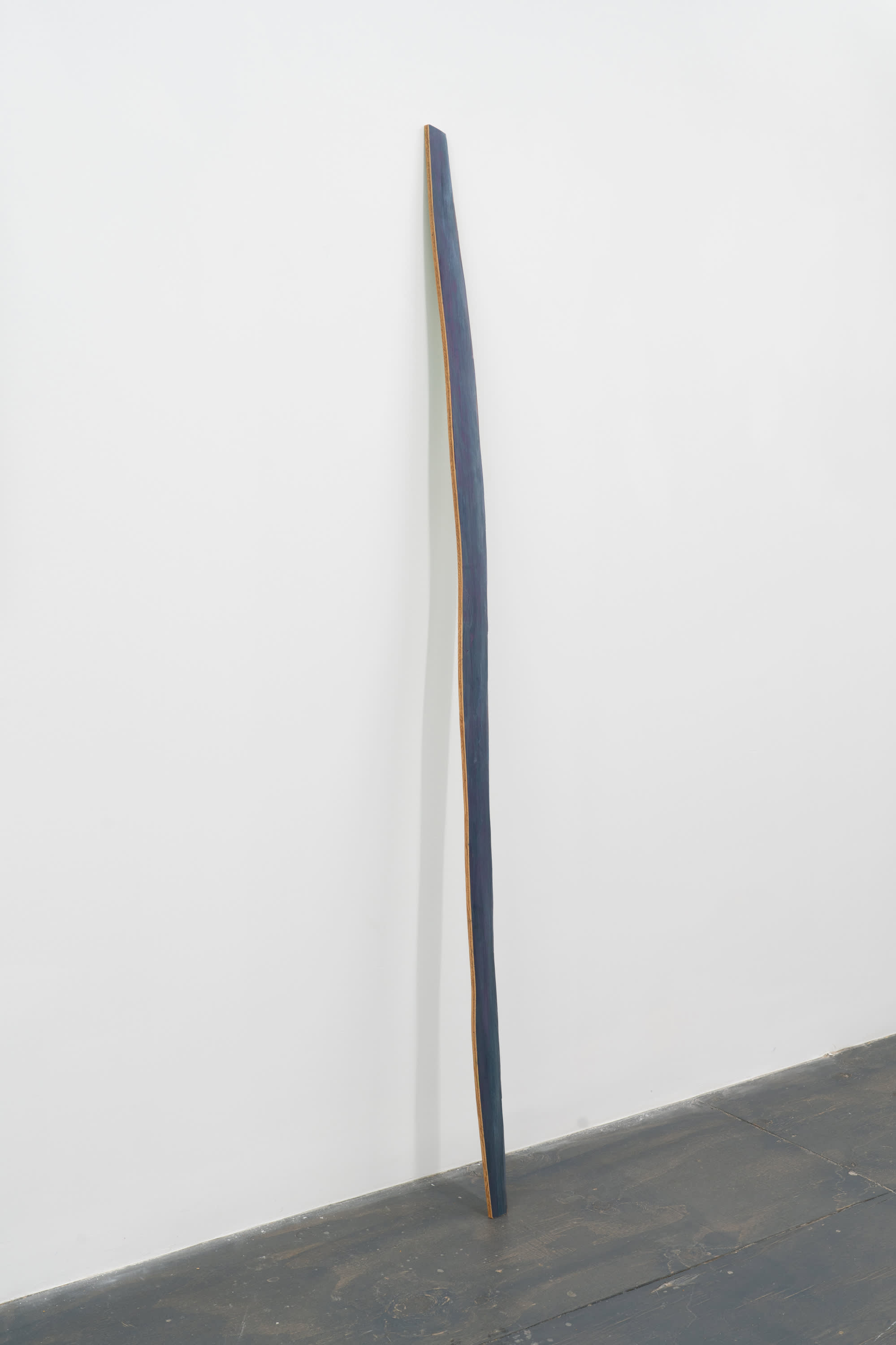 3/4 view of Monique Mouton sculpture featuring plywood cut in the shape of a stick and painted a blue gradient.