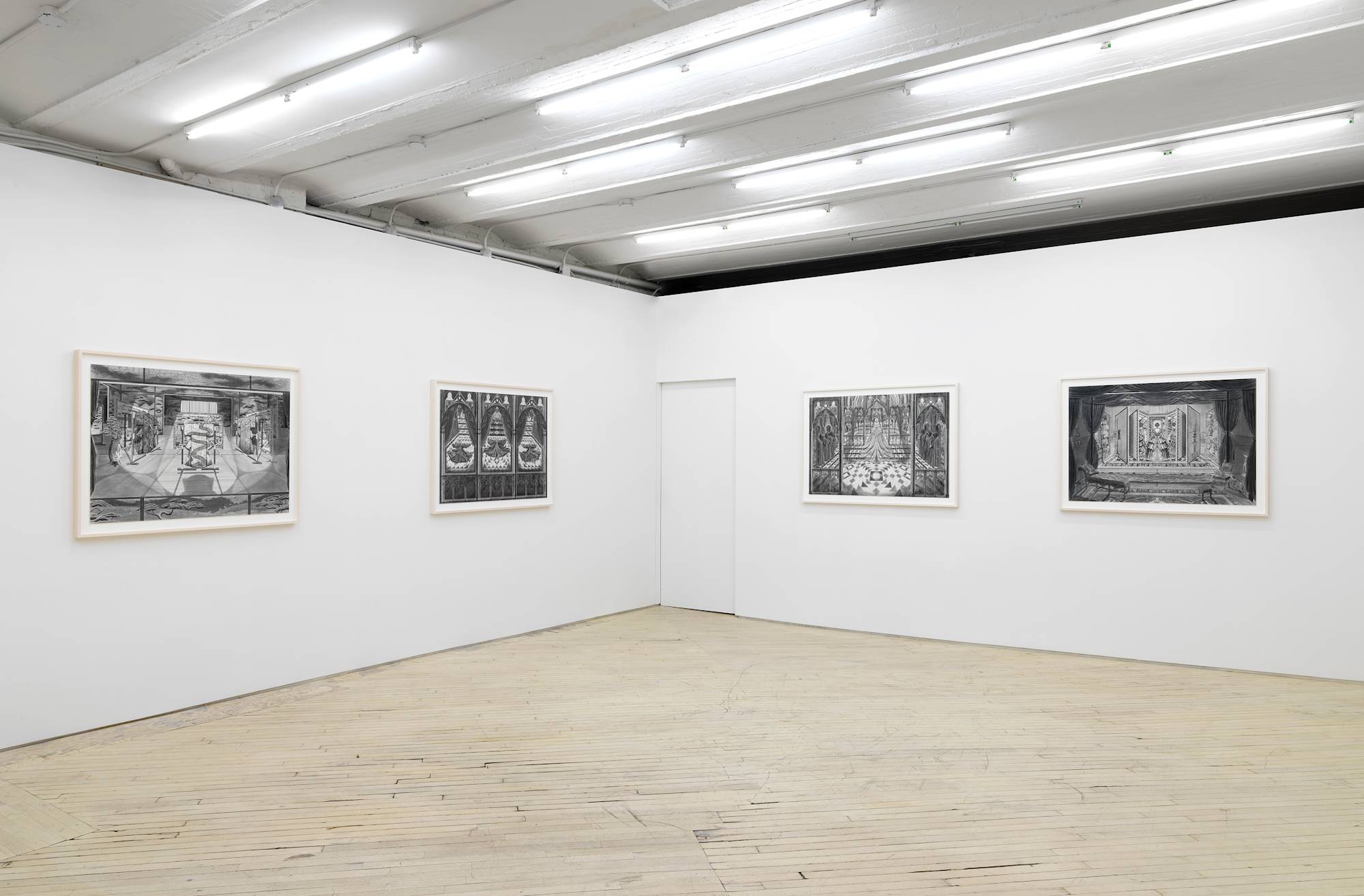 Four large ink and graphite drawings depicting intricate interior spaces hanging evenly spaced apart in off-white frames.