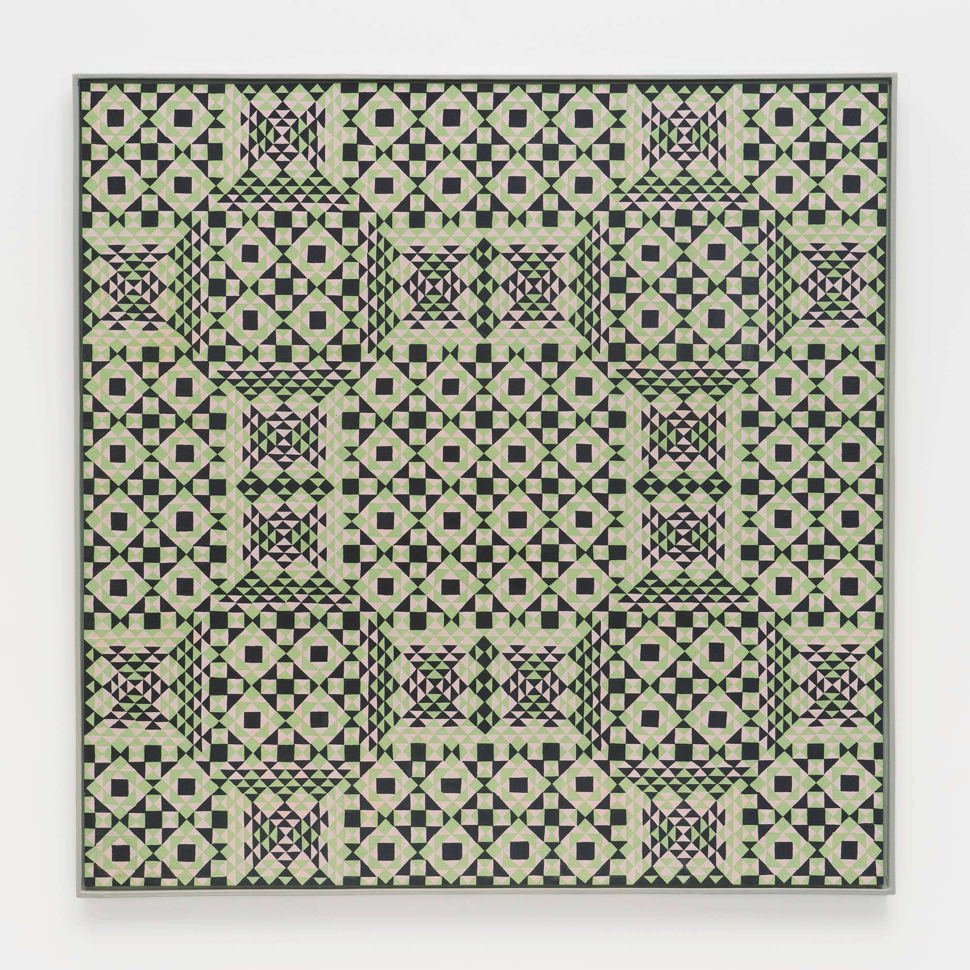 A colorful, symmetrical, geometric painting on board consisting of a pattern of repeating diamonds and triangles of green, light green, and dark green, in a light green artist frame.
