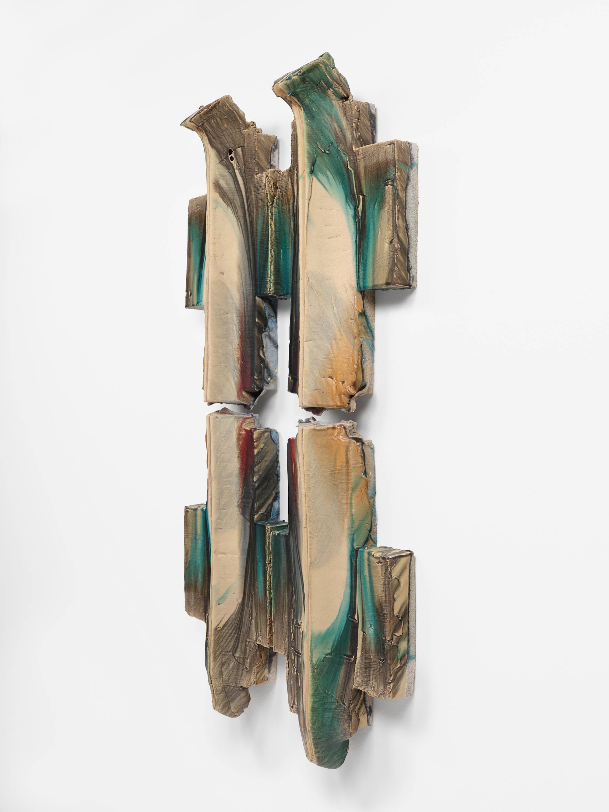 Three quarter view of four individual cross shaped ceramic sculptures mounted to a white wall in a square orientation to form the shape of a pound sign (#). They are glazed in hues of aqua, red, and yellow.