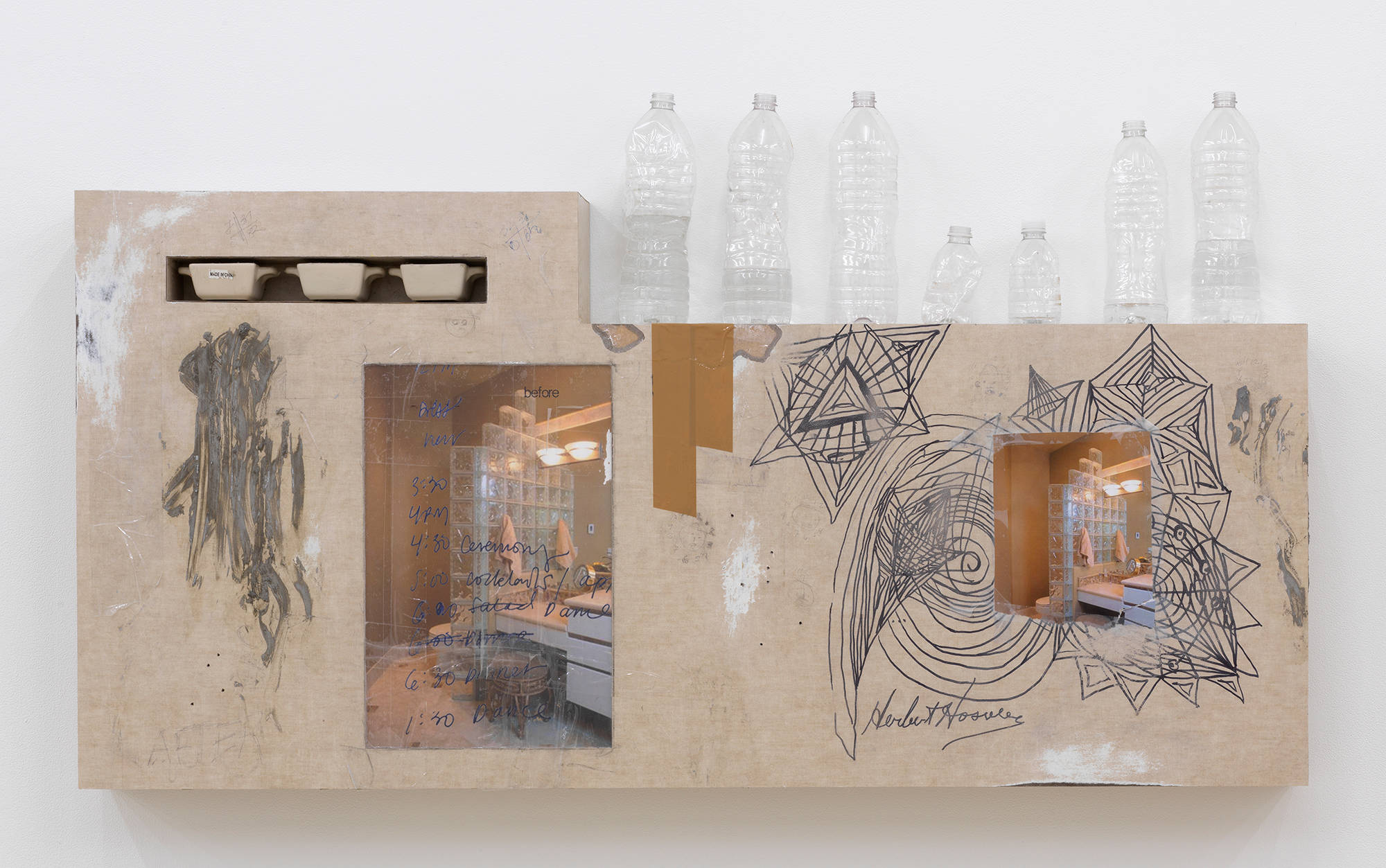 Image of an Artwork installed on the wall. Contains images, drawings, and water bottles.
