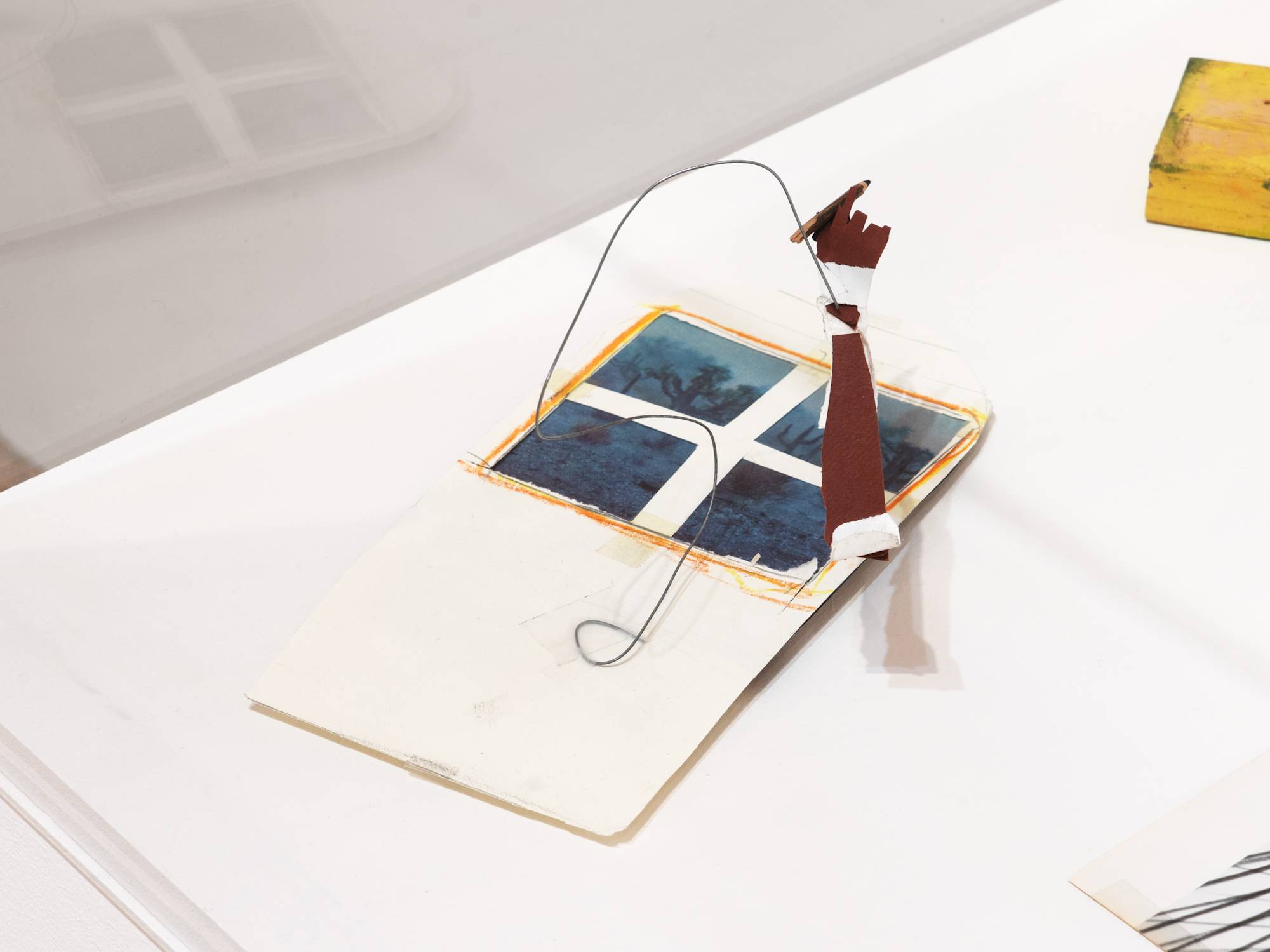 Writer’s Window, 2026, Crayon, graphite, acrylic, and tape on paper, found book page, wire, cardboard, and wood, 8 ¾ × 5 ½ × 5 ¼ in. (22.23 × 13.97 × 13.34 cm)