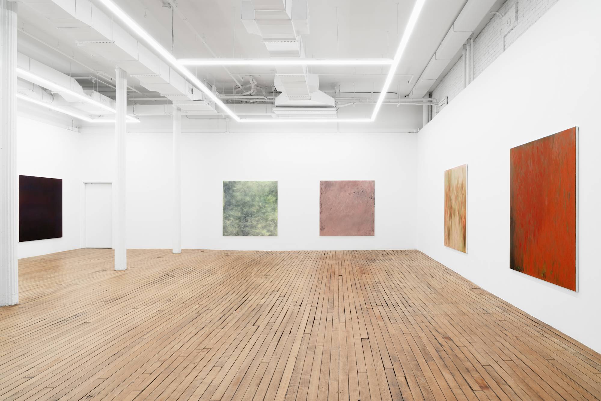 Five large abstract paintings full of gestural marks spaced evenly throughout a brightly lit gallery space.