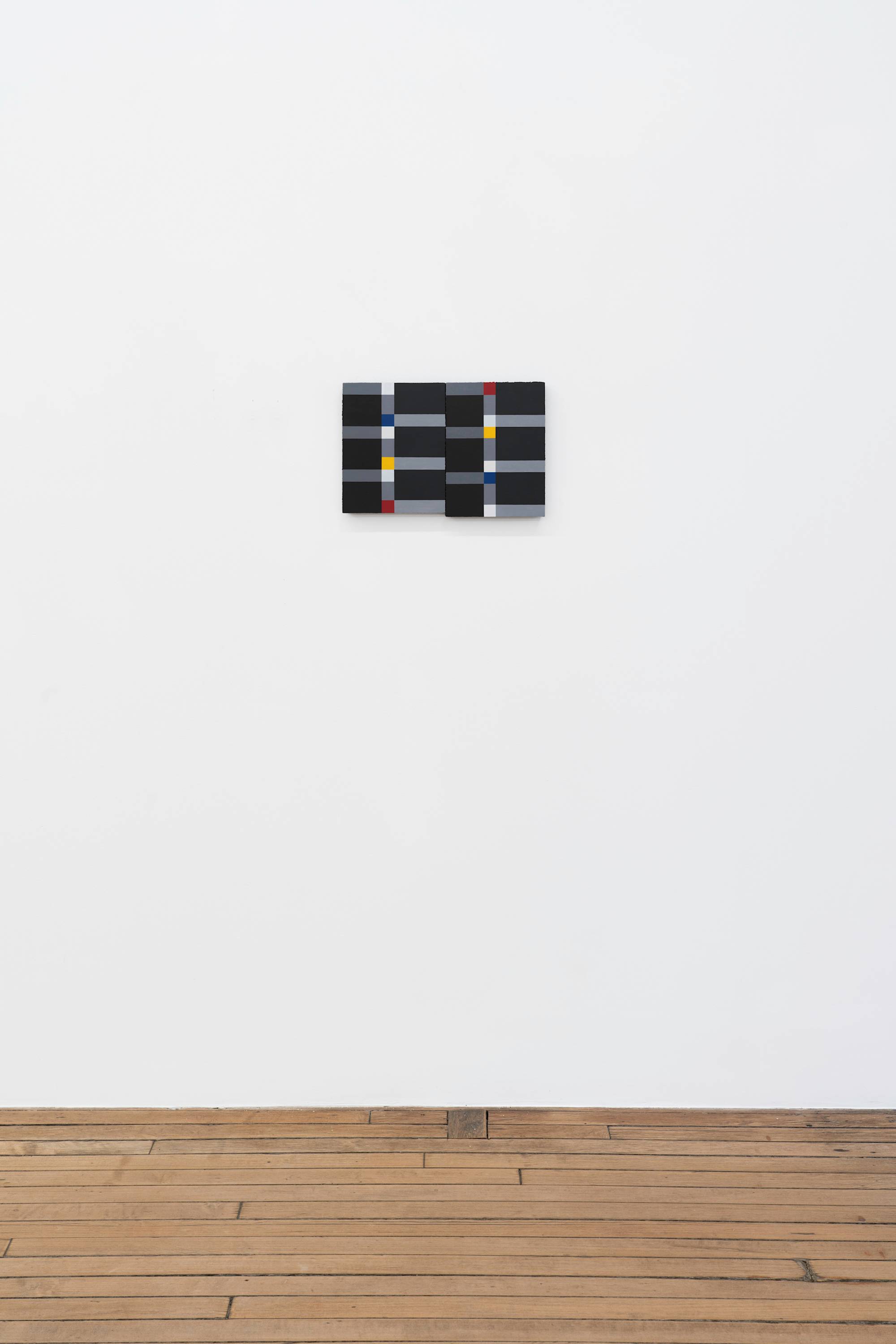 Two abstract Ian Miyamura paintings of red, yellow, blue and white squares connected by grey rectangles on a black background hang on a gallery wall butting against each other above a wood floor.