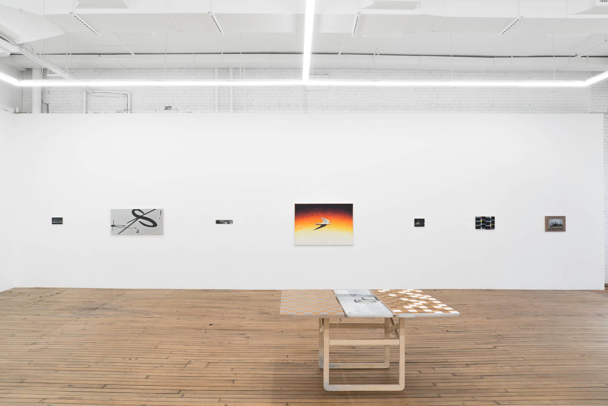 View of gallery with 7 Ian Miyamura paintings hanging on the wall, evenly spaced. A table sculpture sits in the center of the gallery.