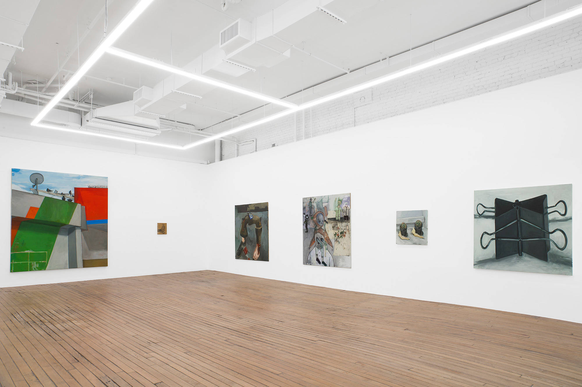 This image depicts the South West corner in the upstairs of the gallery. Paintings of pigeons, a child, a pipe with disembodied feet, cacti, and binder clips fill the two walls.