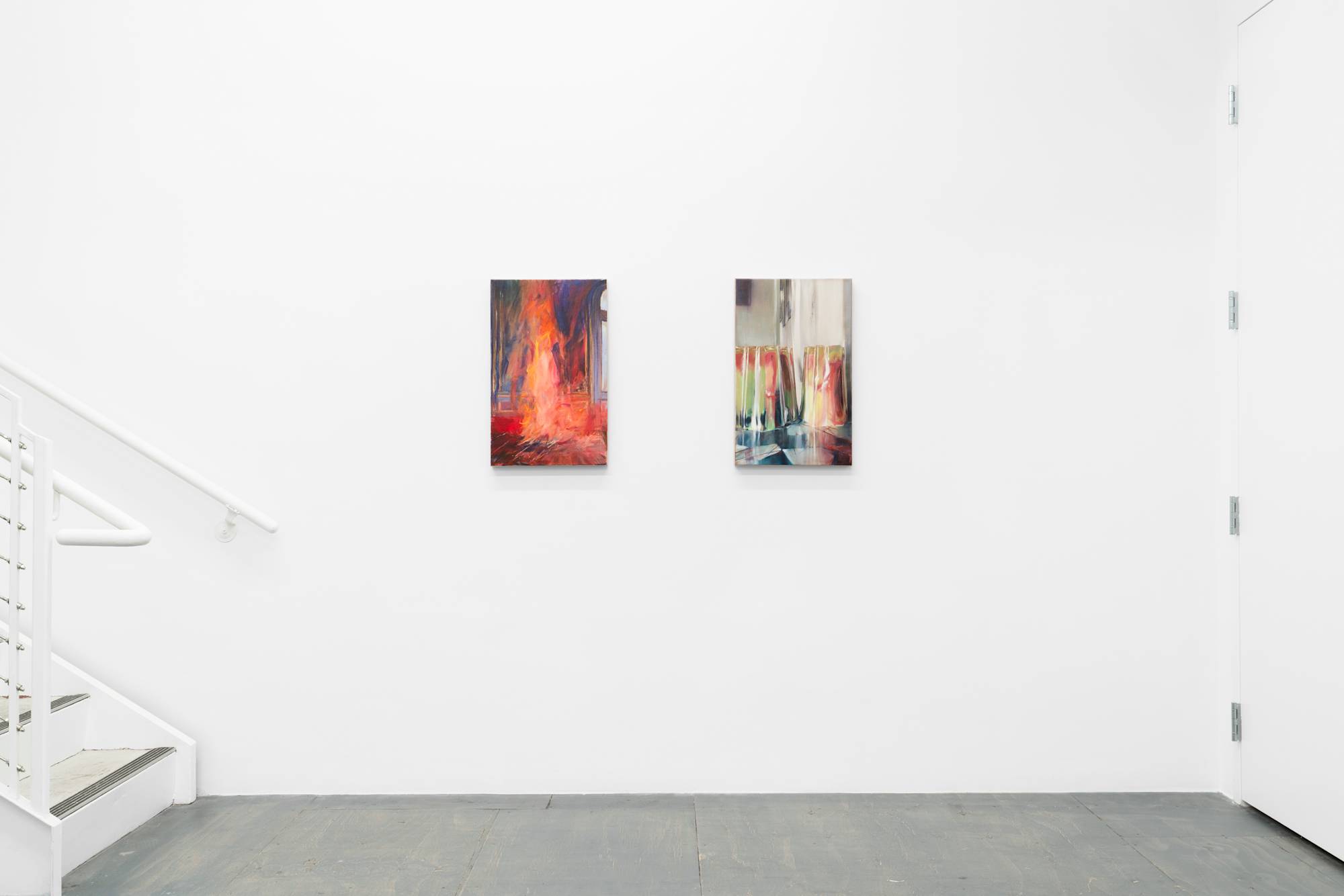 Two abstract paintings by Tom Holme's hang above a grey floor in a gallery. A staircase ascends to the left, out of frame.