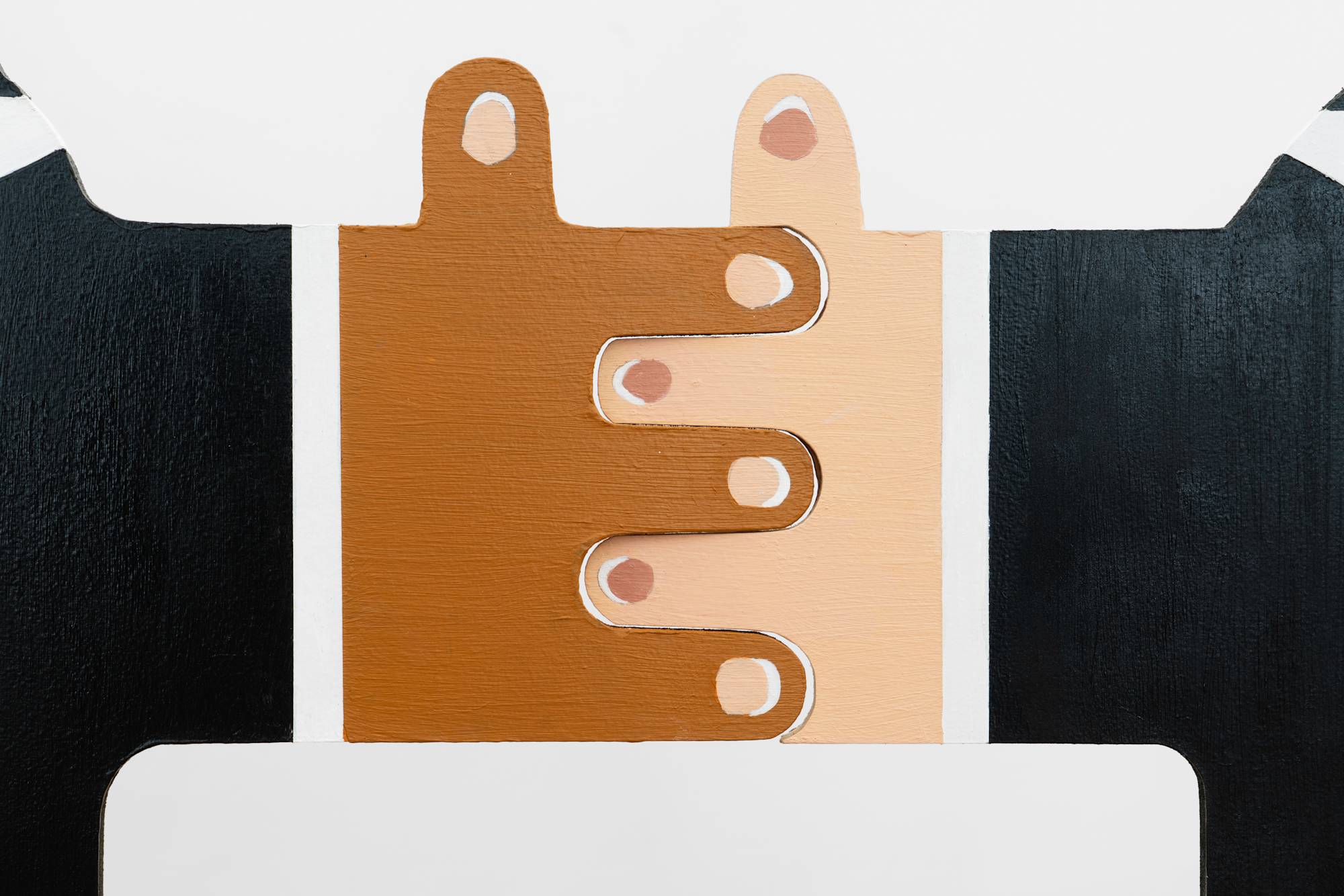 A detail of the interlocking hands of Libby Rothfeld's 'If I can Dream Group 2' sculpture.