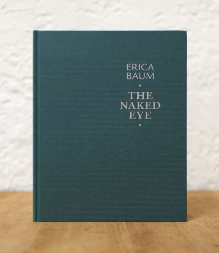 Image of a book by Erica Baum titled The Naked Eye with a dark green cover and silver embossed text.