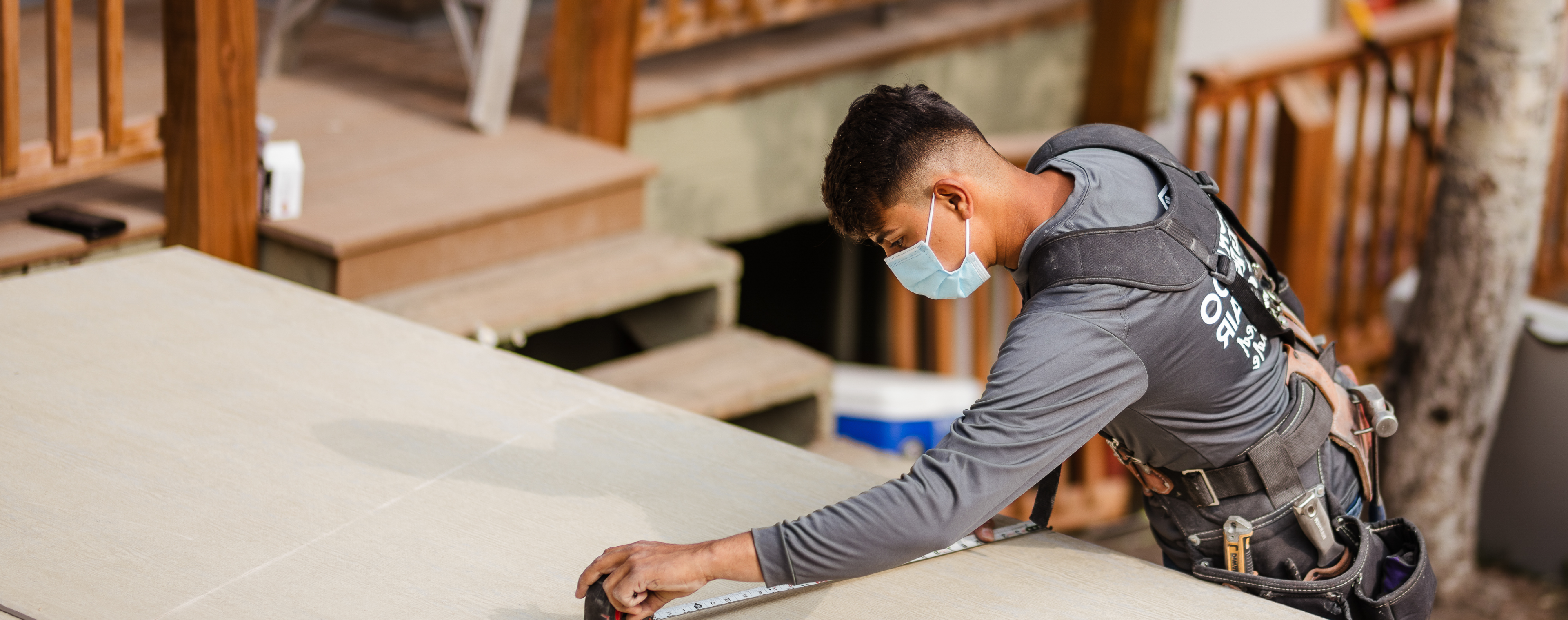 Worker Measuring Something on a Table