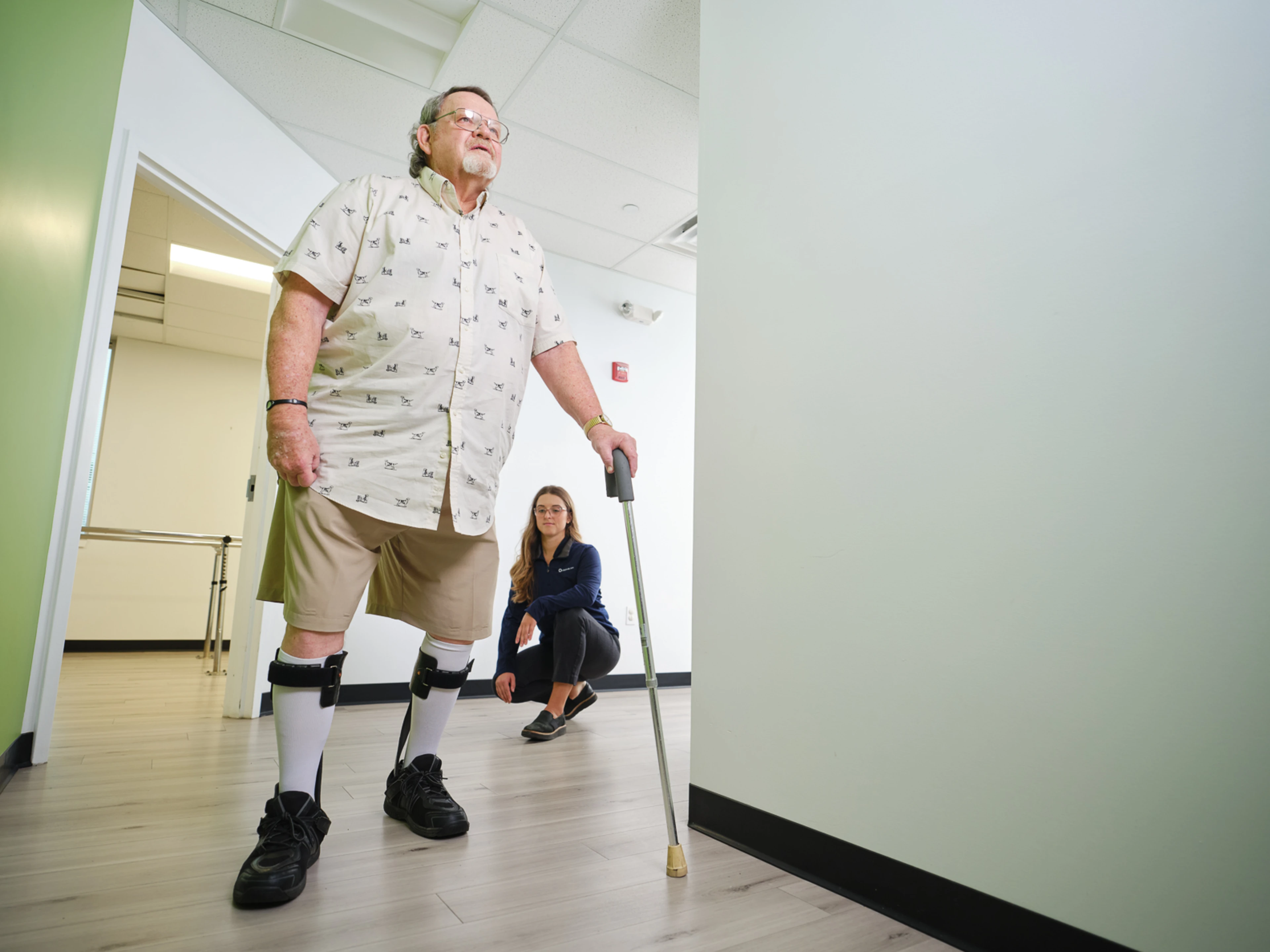 A lower leg orthosis user trialing a product with the supervision of a Certified Prosthetist Orthotist