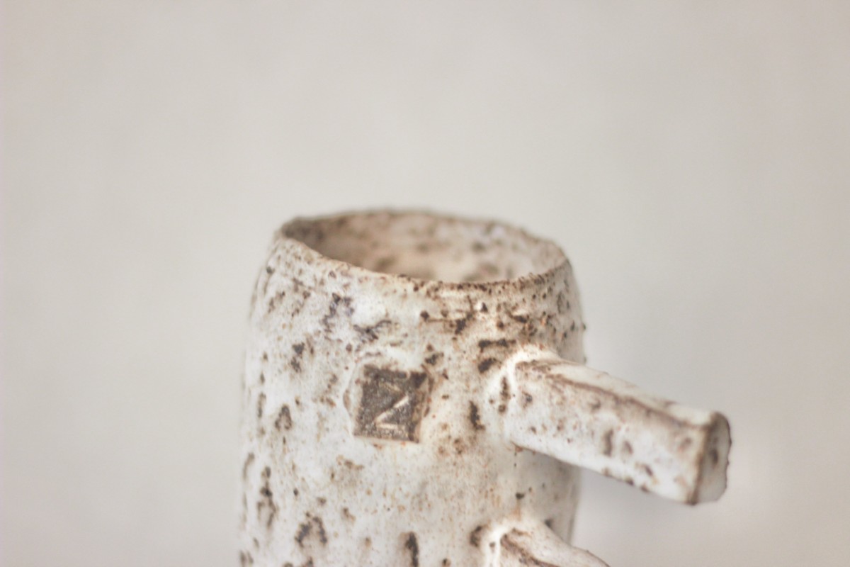 spotty ceramic mug on a white background close shot 1