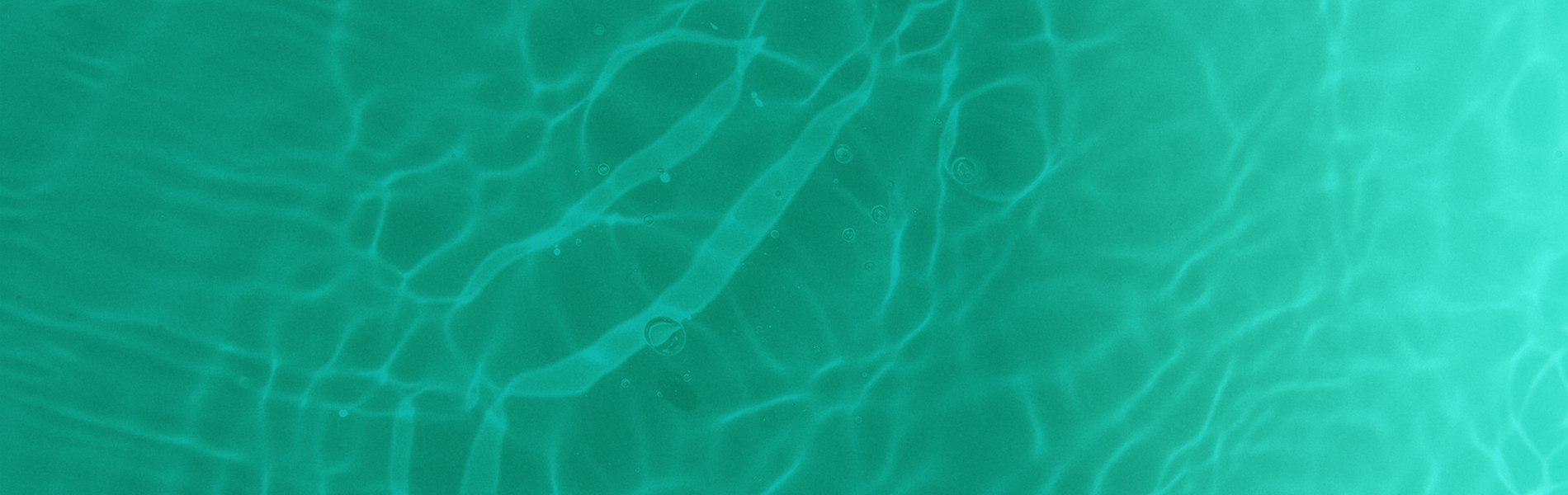 Ripples in a pool of water with a turquoise overlay on top of the image.