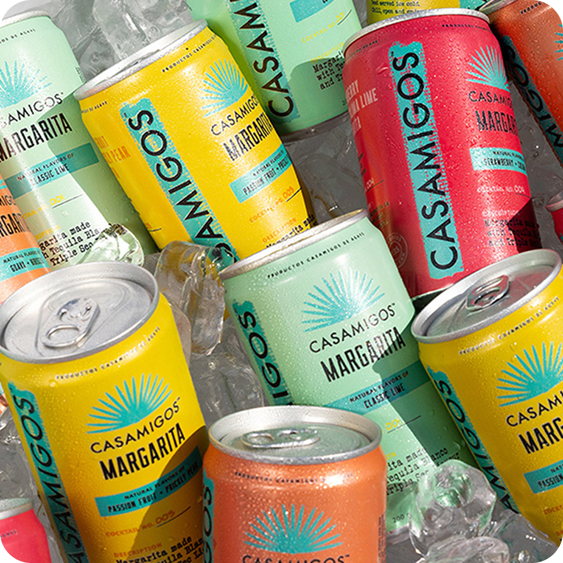 Assorted Casamigos Margarita™ in colorful cans on ice, ready to drink.