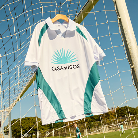 Commemorative World Cup Casamigos football fan jersey displayed on a goal net.