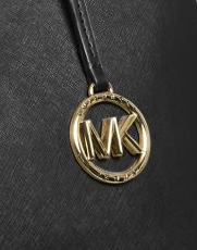 Image showing the hanging Michael Kors circle logo on the Edith satchel