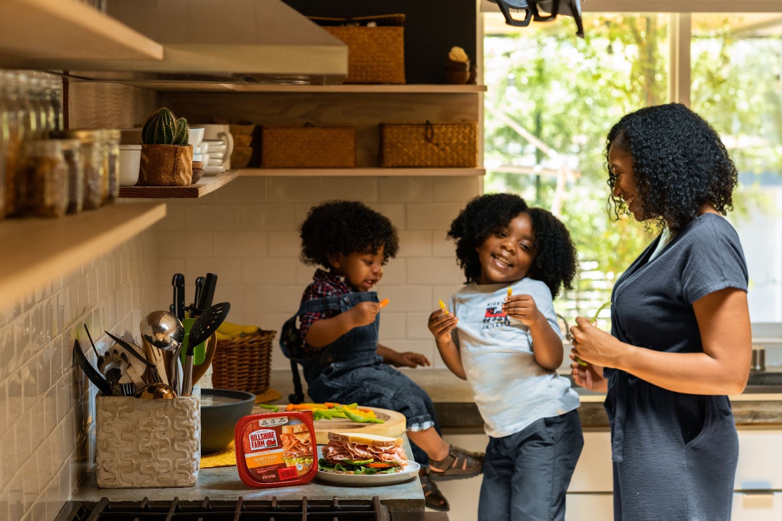 mother and kids prepping food in kitchen