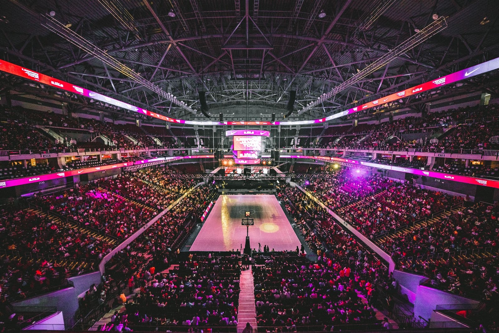 A packed basketball game event.