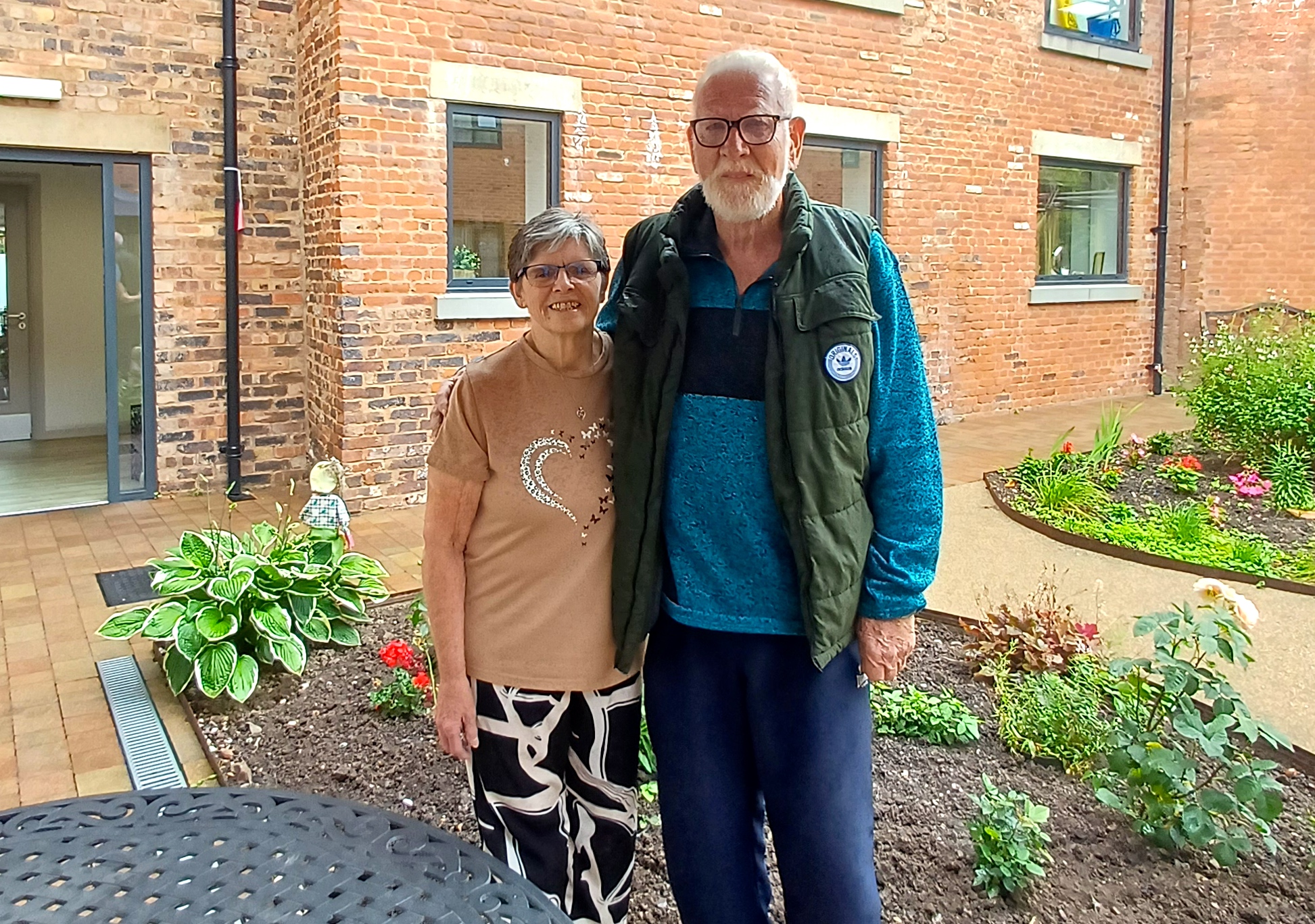 Asset - Apartment tenants Eileen Allman and Paul Gray enjoy the fruits of their labour. 