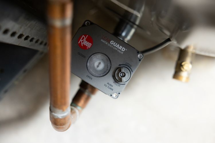 The water shut off valve of a Rheem heat pump water heater.