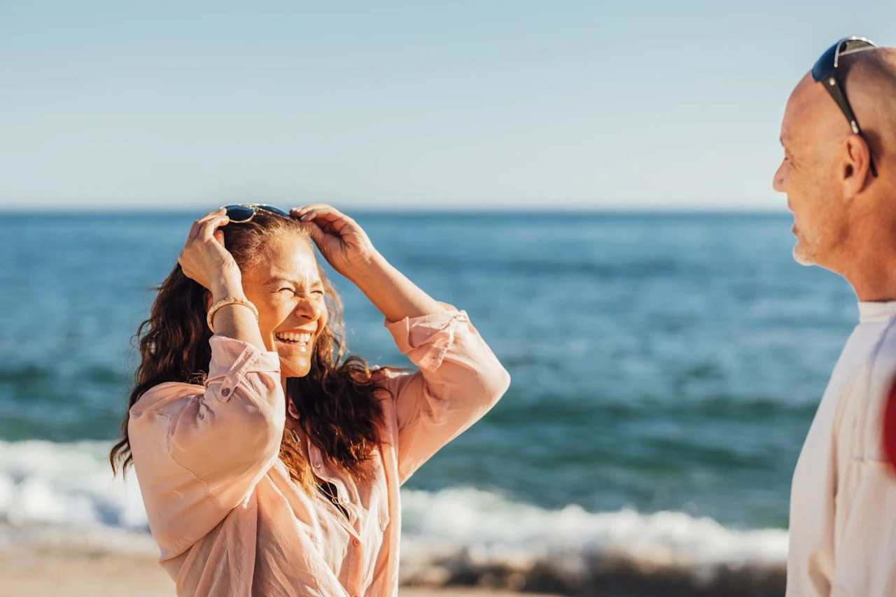 A couple on the beach talking about reciprocal wills.