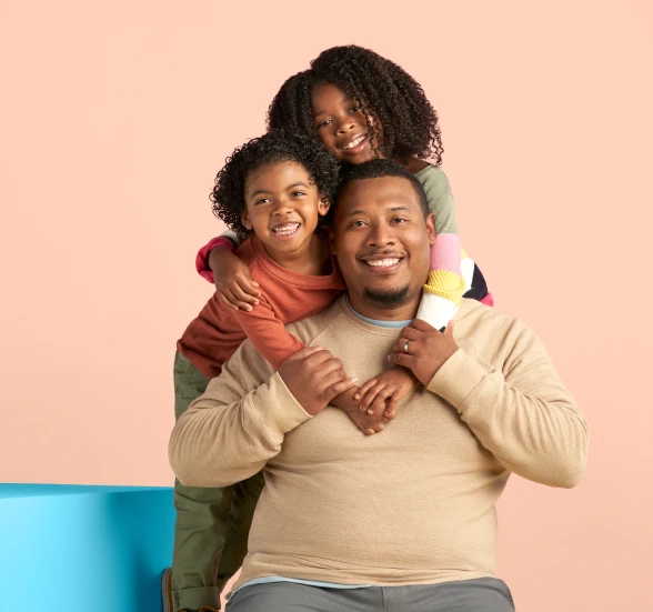 kids hugging dad