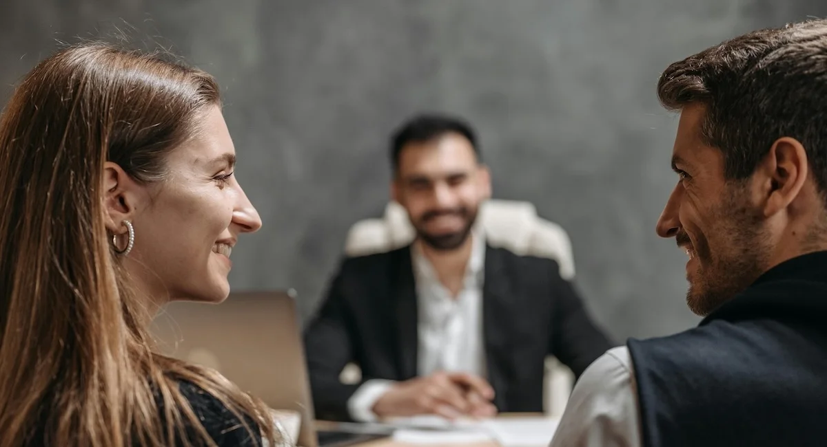 Clients and attorney having a conversation.