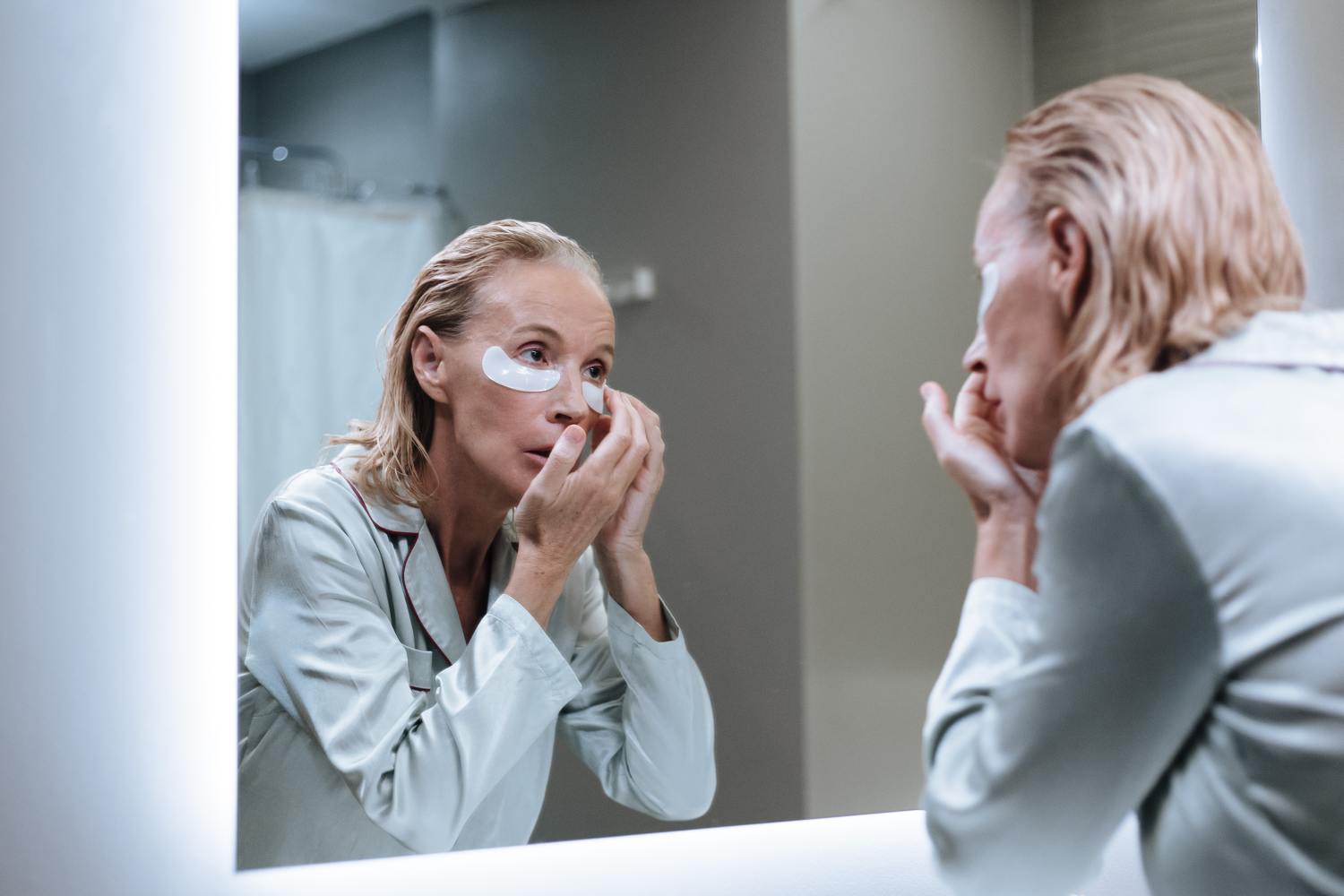 Woman doing skincare while thinking about what is a reverse mortgage.