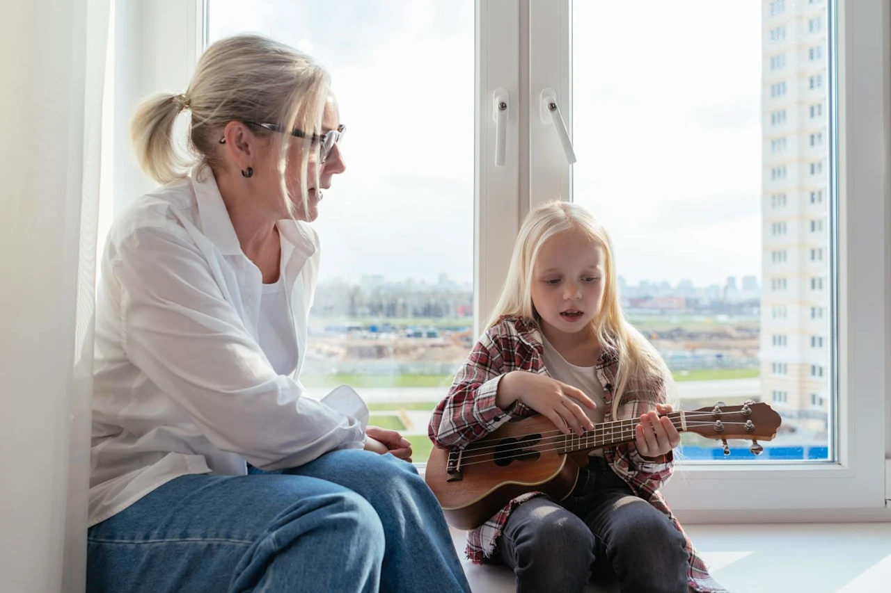 Woman with granddaughter playing ukulele after learning about letter of instruction and why you need it.