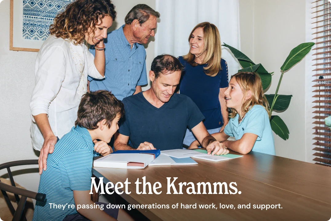 The Kramm family gathered around a table — passing down generations of hard work, love, and support.