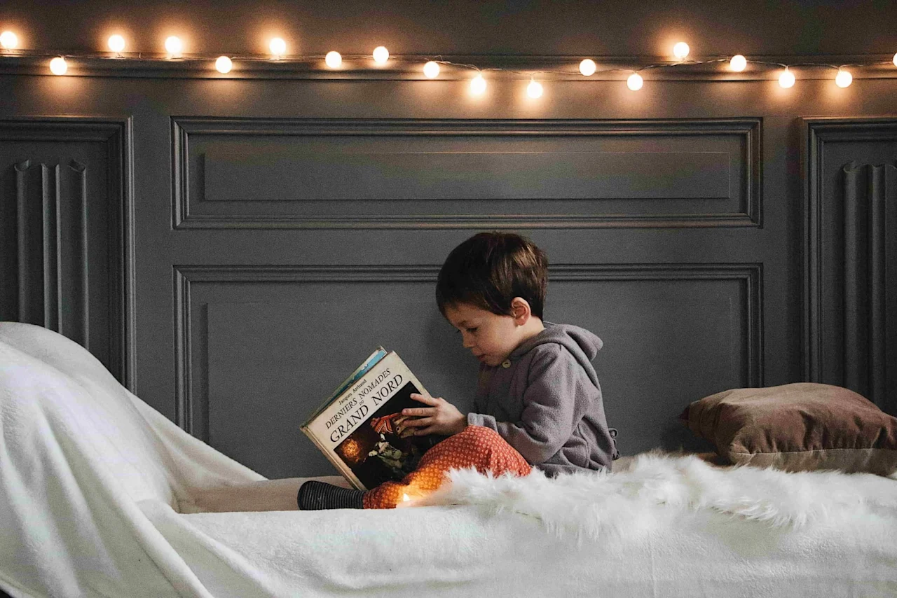 Child reading a book.