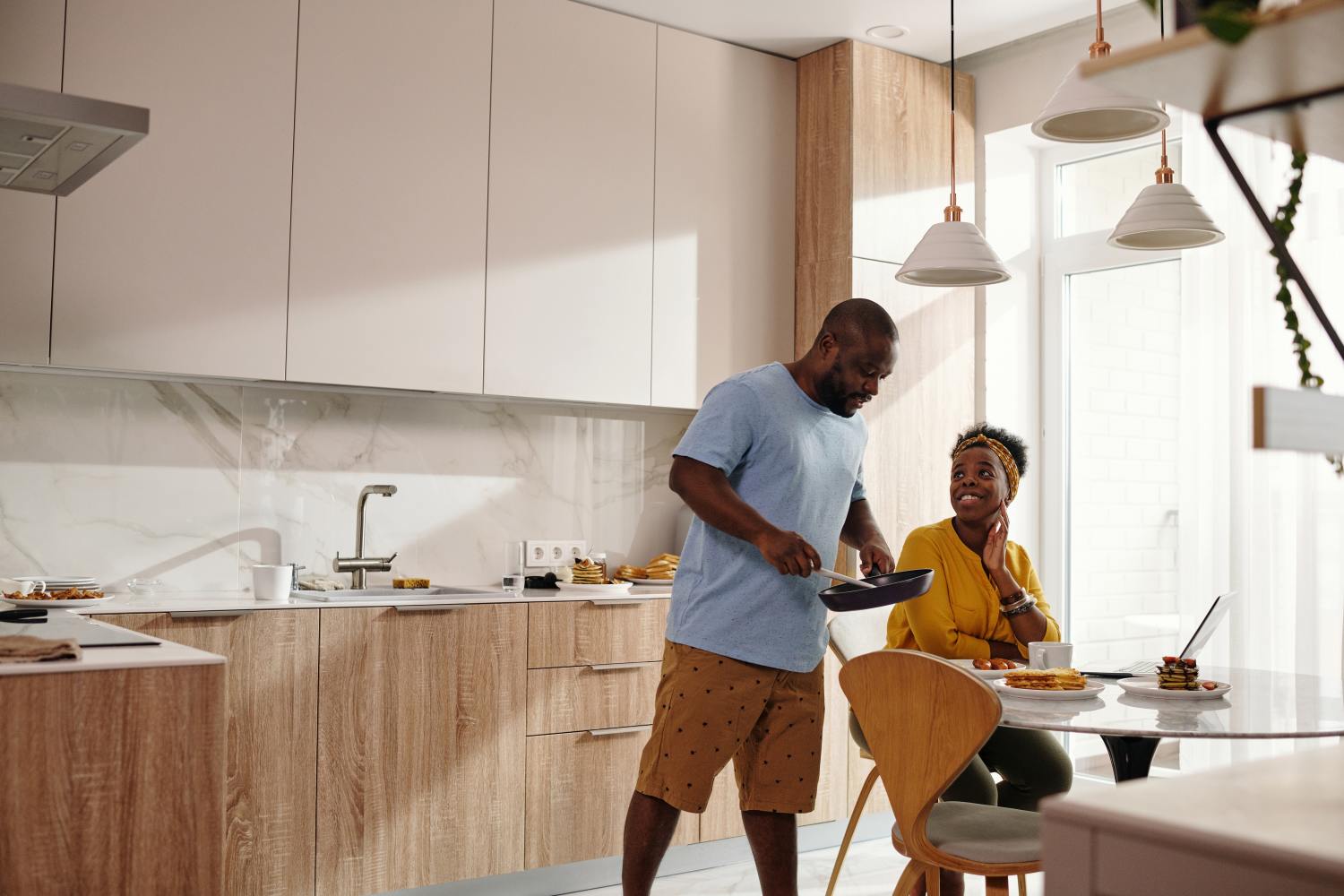 Couple in kitchen after learning about Qualified Personal Residence Trusts.
