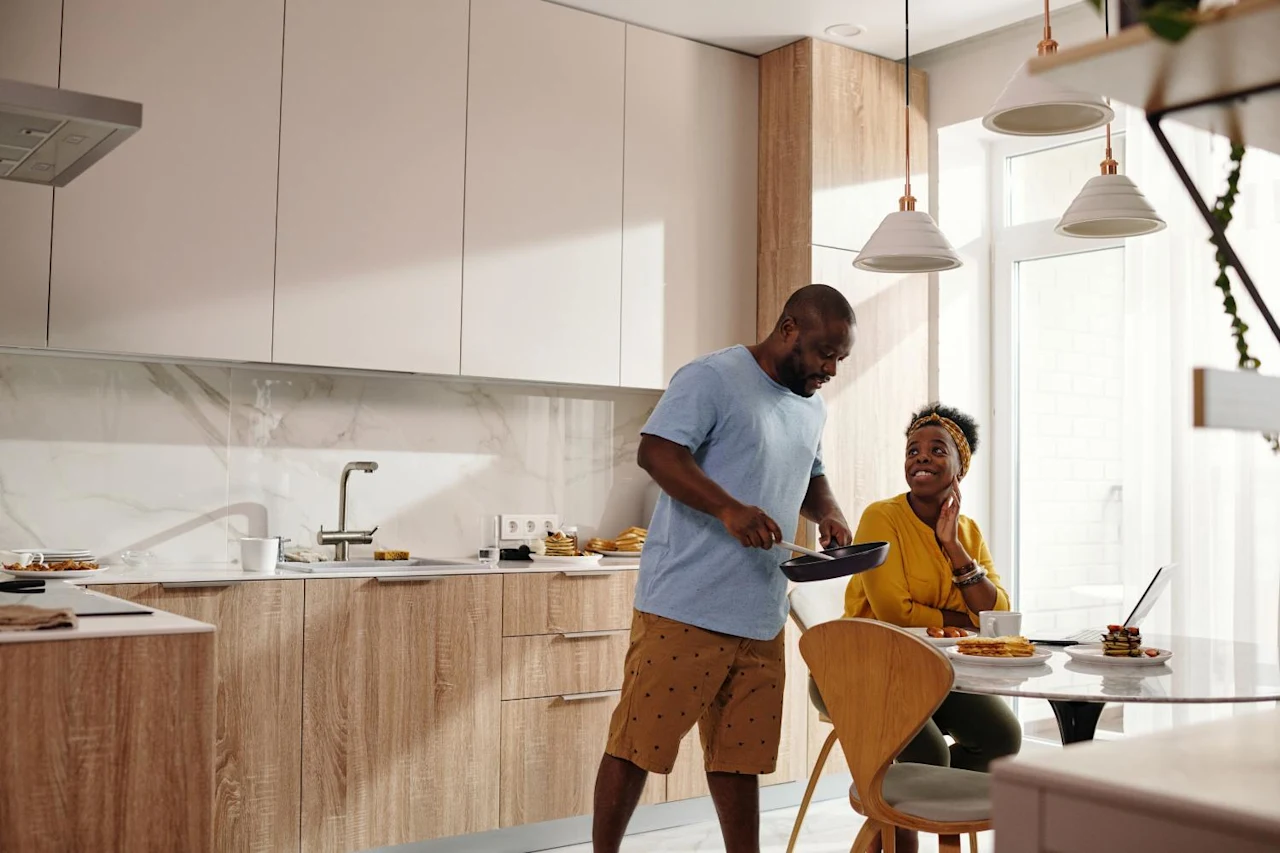 Couple in kitchen after learning about Qualified Personal Residence Trusts.