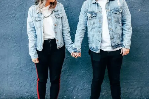  An-unmarried-couple-holding-hands-outside. 