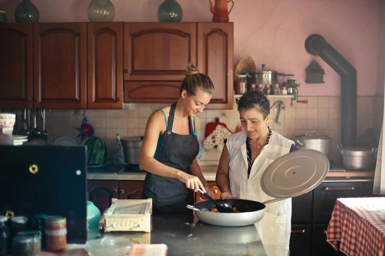 Mother cooking with daughter while having a conversation about wills.