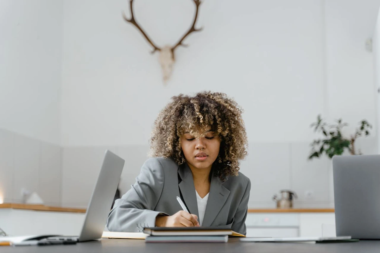 Young woman creating an estate planning checklist.
