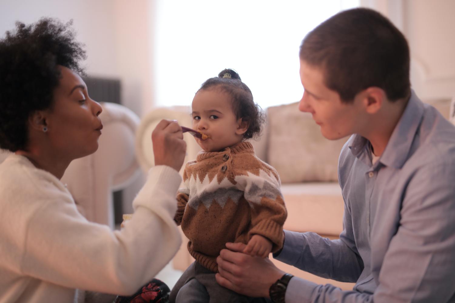 Parents playing with child after learning about and setting up a grantor trust.