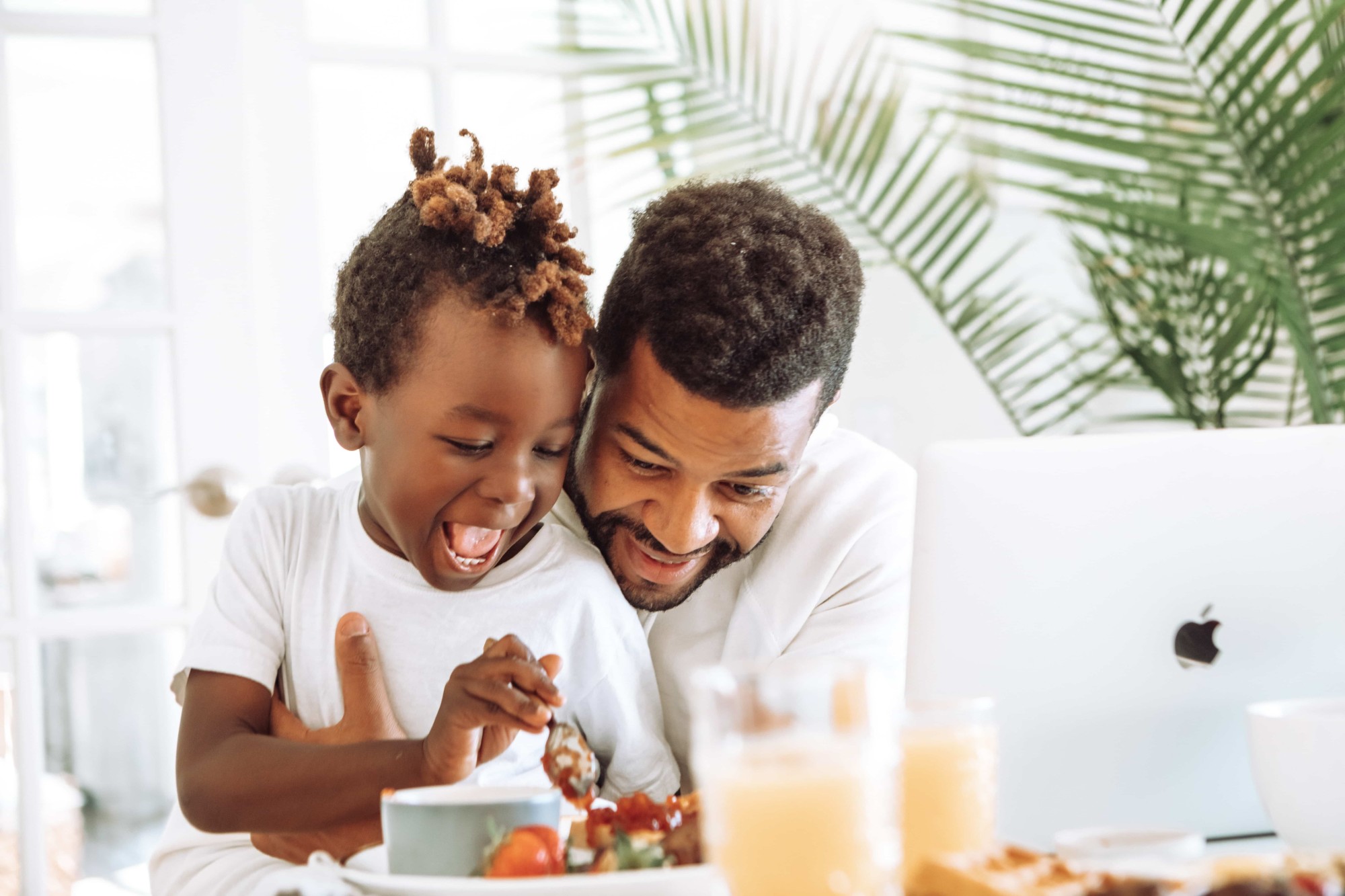 father and son having breakfast