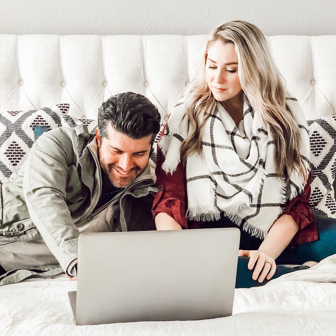 Couple learning what a Will is on their laptop.