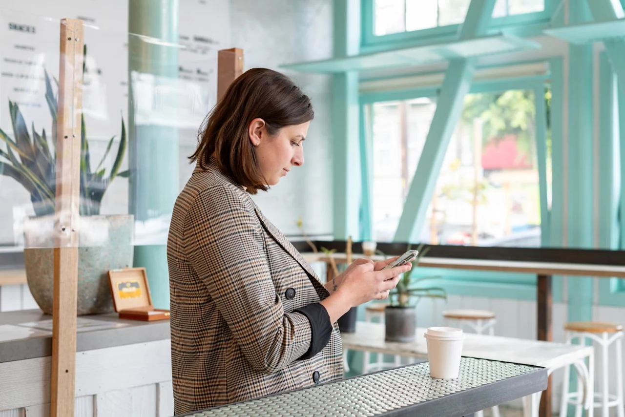 Woman on phone researching if you can inherit your parents' debts.