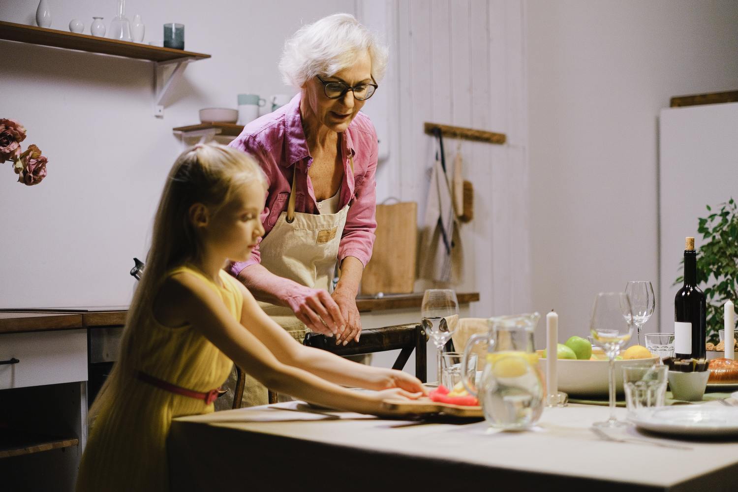 Grandmother baking with her grandchild after learning difference between pro rate vs non pro rate distribution.