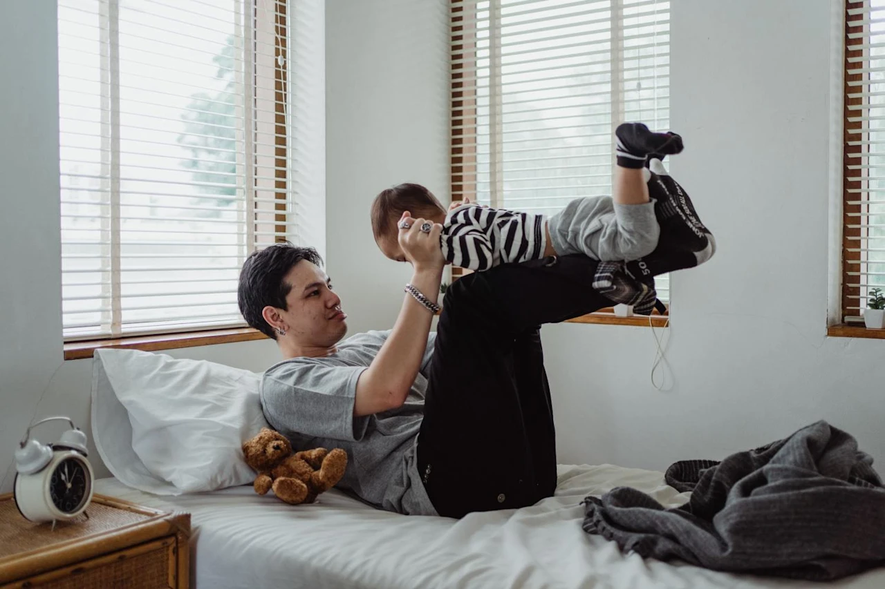 Man playing with child after learning about the benefits of bloodline trusts.