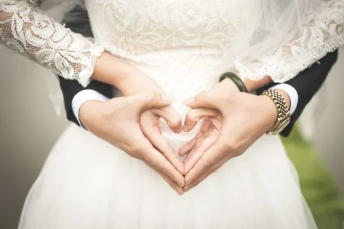woman-making-heart-shape-with-hands
