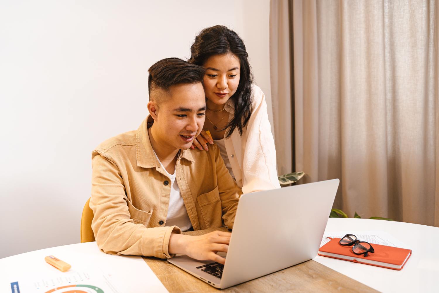 Couple researching mistakes to avoid when taking care of their parents.