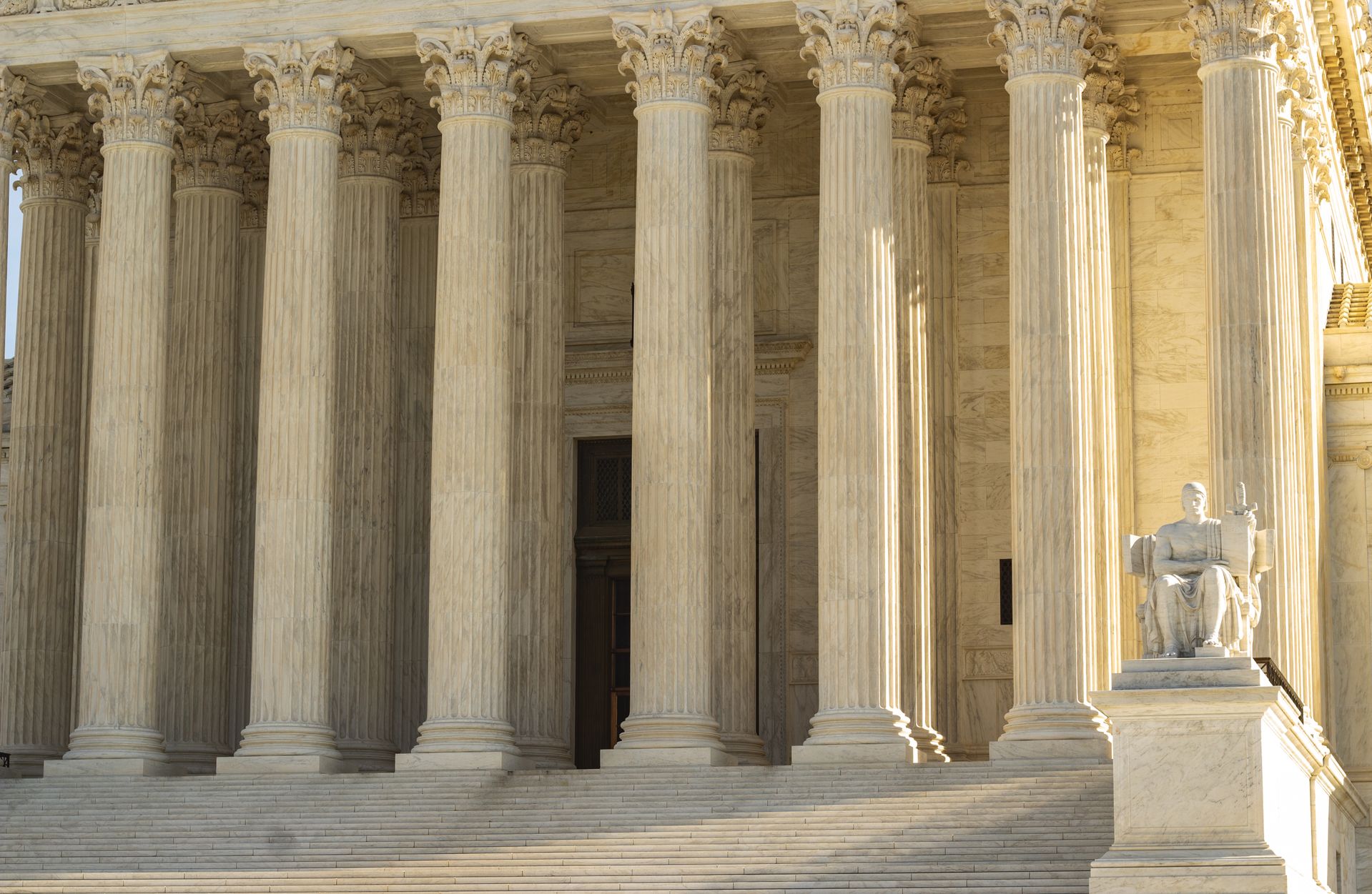 Neoclassical facade of the Supreme Court of the United States in Washington, D.C., featuring massive marble Corinthian columns
